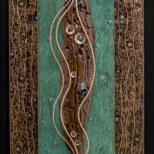 Hand tooled copper using chasing and repousse and finished with patinas that I create. Mixed with natural and organic elements found on my travels.
